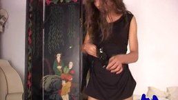 Well-hung Natalia gets undressed and masturbates